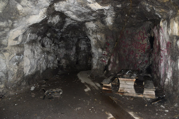 Bunker carved out of the stone with an old table and benches, Sirevg kystfort