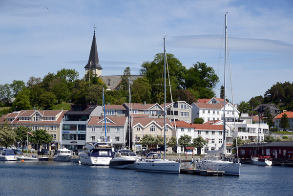 Sailboats in the town harbor of Grimstad