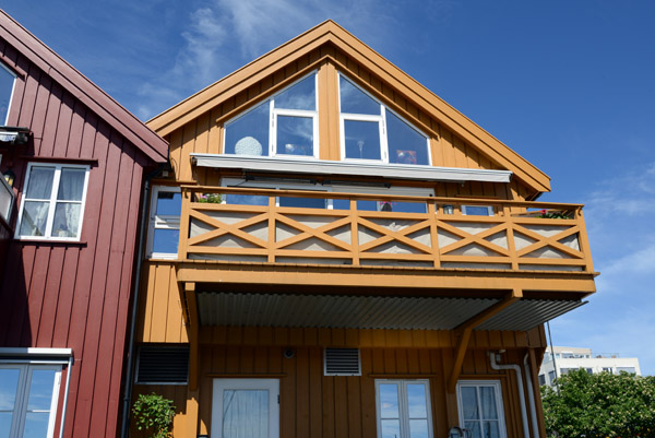 Modern wooden houses along the waterfront of Grimstad