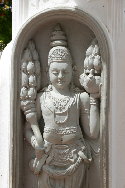 Statue at a shrine before the ancient temple