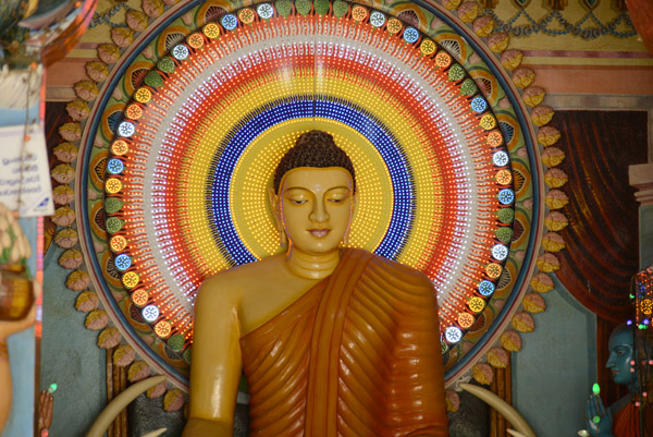 Modern Buddha image with LED halo, Kataragama
