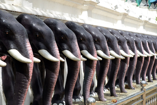Elephants line either side of the entrance to Kataragama Temple