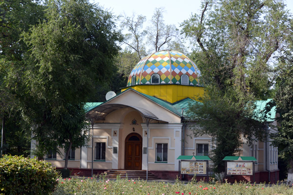 Side building with a colorful dome next to Zenkov Cathedral