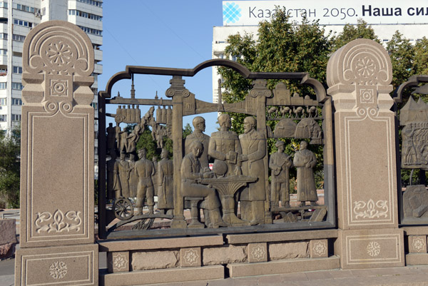 The fence surrounding the Independence Monument consists of low relief sculpture of Kazakhstan's history