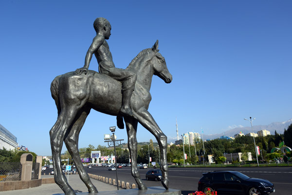 Two equestrian statues featuring children riding bareback flank the Kazakhstan Independence Monument