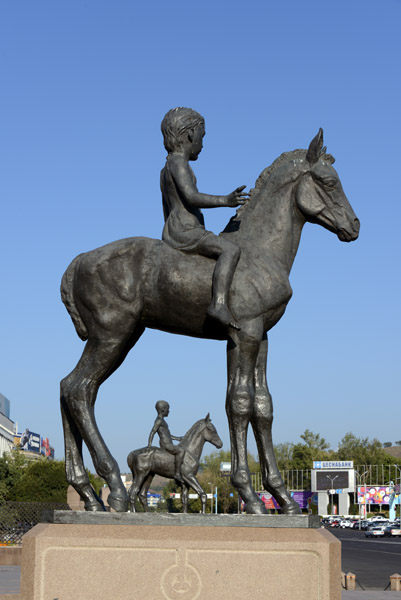 Young girl astride a horse, Kazakhstan Independence Monument