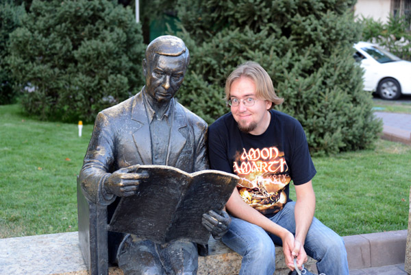 Sculpture of a man reading, Al Farabi District, Almaty