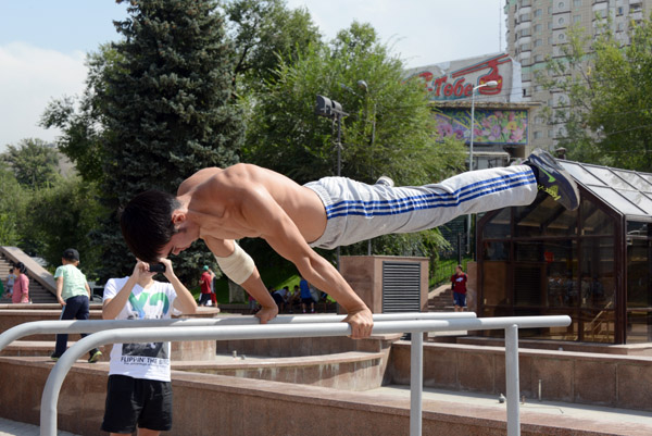 Kazakh gymnast on the parallel bars, Republic Palace