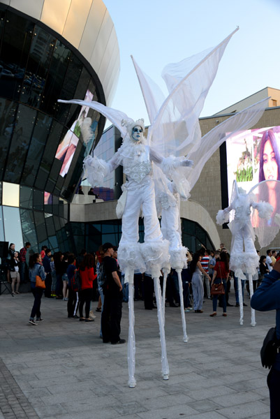 Artistic performers on stilts