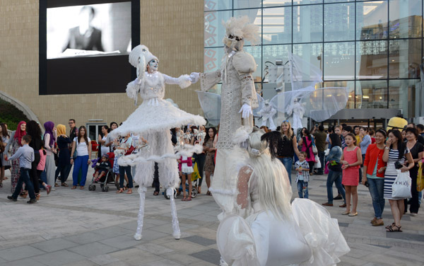 Performers on stilts, Grand Opening of Dostyk Plaza