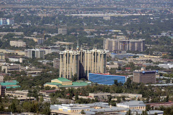 High-rise Stolichniy Center with the blue-colored Almaty Hotel