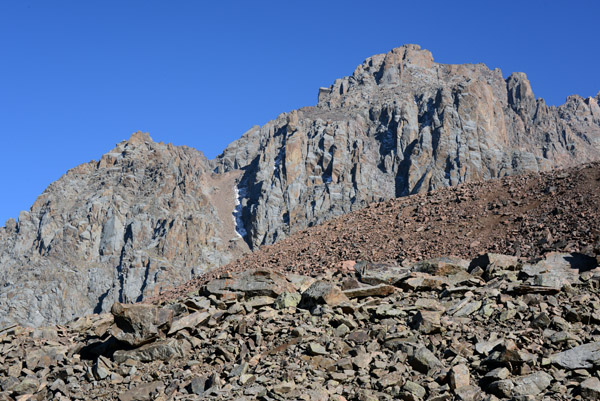 Rocky debris field on the slopes beneath the stoney peaks