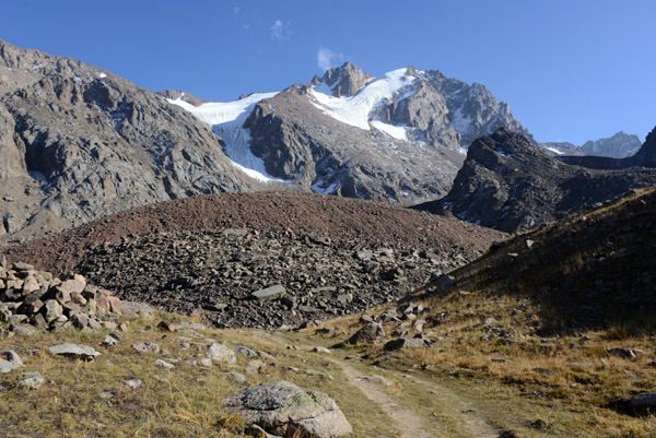 The trail probably leads to a clear view of the summit of Mount Komsomol