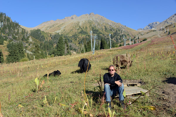 Steven sitting with yaks