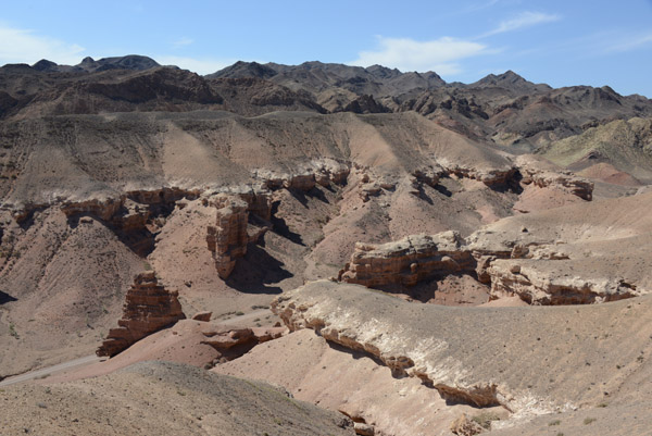 A road leads through the canyon to a campsite by the Sharyn River