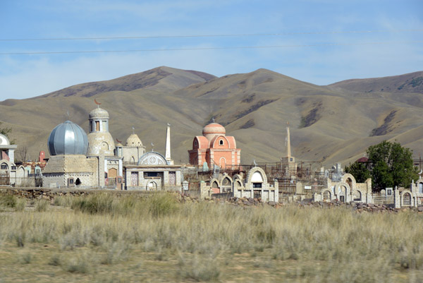 Kazakh cemetery with some ornate monuments outside Kegen