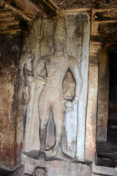 Two-armed Shaiva Guardian with weapons and a snake