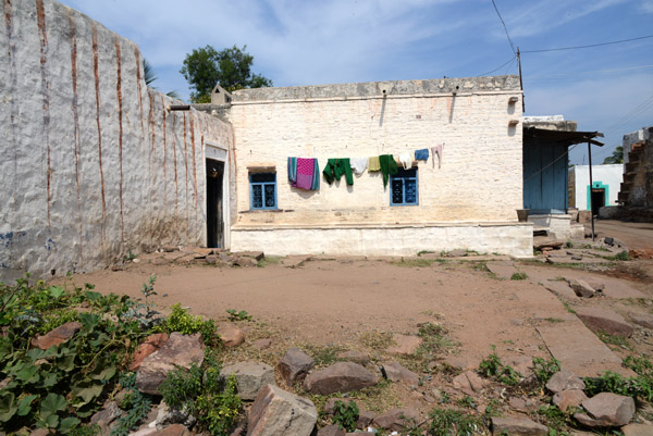 A village of white-washed stone houses lies among the ancient monuments of Aihole