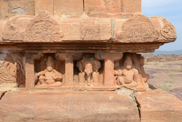 Carved figures on the east side of the Jain Temple, Meguti Hill