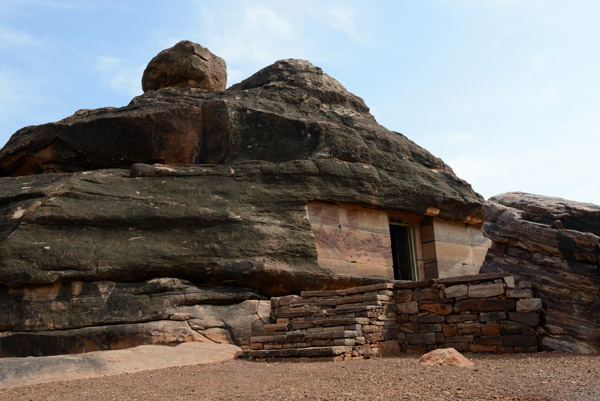 Jain cave temple carved into the south side of Meguti Hill