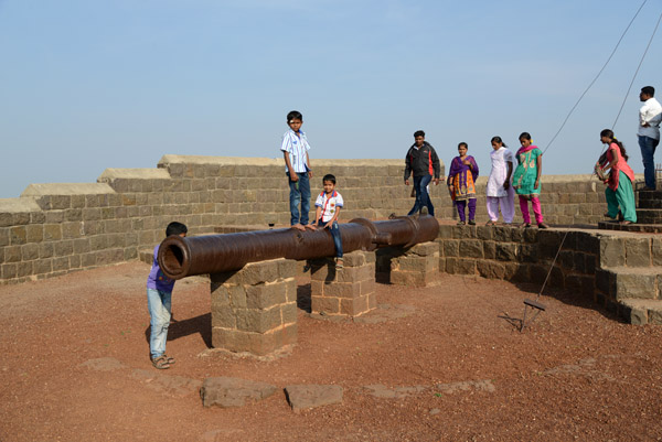 Kids climbing on the second cannon