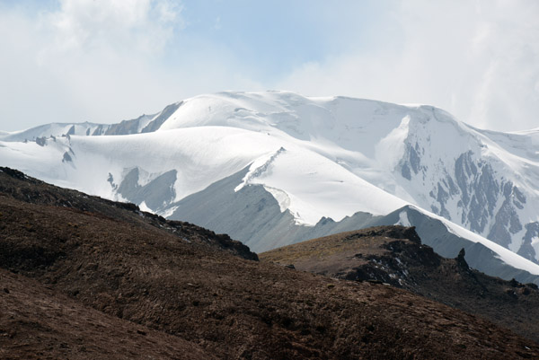 Snow covered mountains of the Trans-Alay Range rising to 21,000 ft west of the Kyzyl-Art Pass