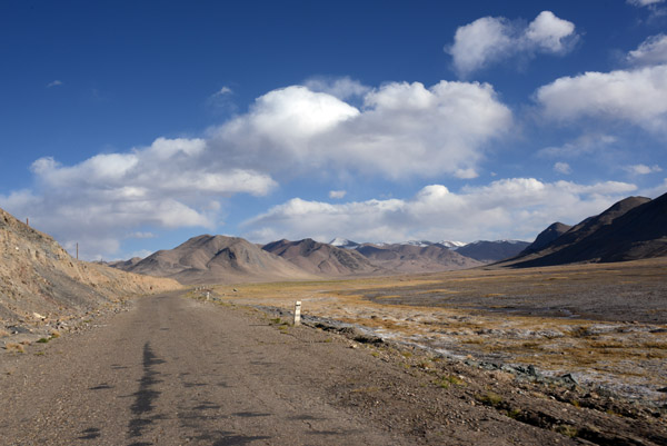 The Pamir Highway M41 enters a high-altitude Tibetan-style landscape