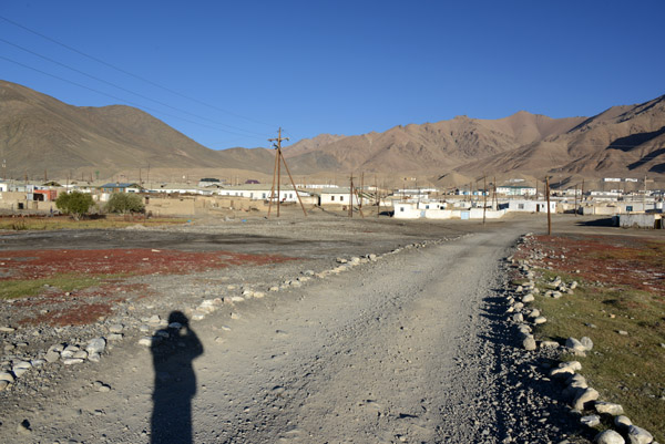 Dirt road leading out of town to the east towards the river and mosque