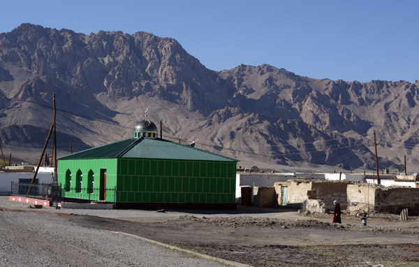 Shiney new green tiled mosque in the first village along the Pamir Highway south of Murghab