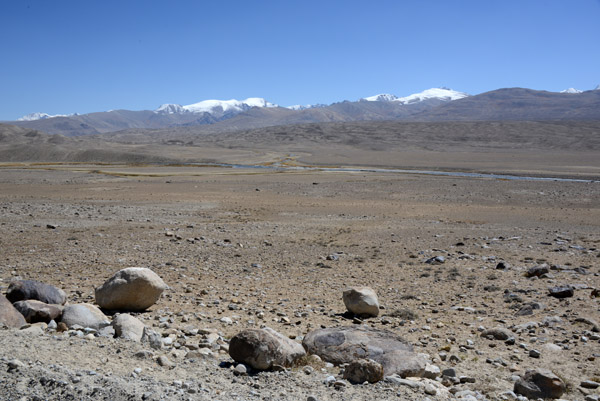 The small river in the distance is the Pamir River, a tributary of the Panj, which forms the Tajik-Afghan border