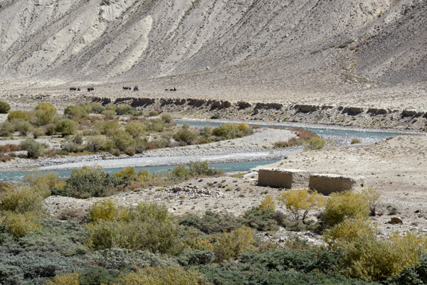 A pair of mudbrick houses along the Pamir River, Afghanistan
