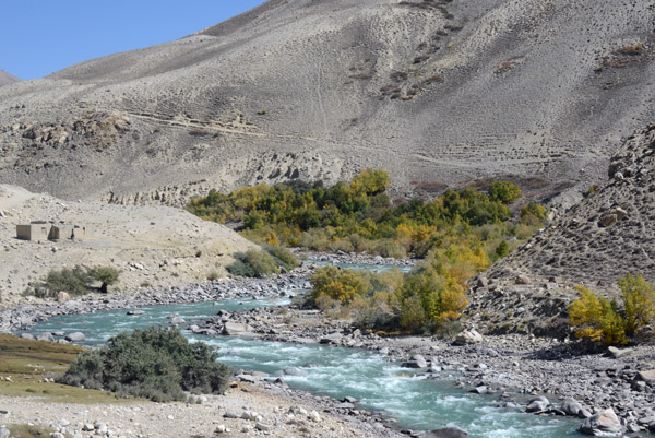 Note the narrow trail descending down this hillside on the Afghan side of the Pamir River