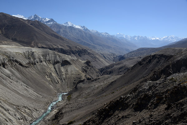 Here, the Pamir River runs through a canyon over 1000 feet lower than the level of the road. We have a steep descent ahead