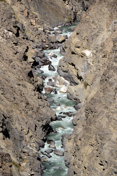 The Pamir River deep below in the canyon