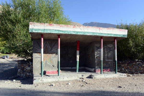 Bus stop with the colors of the Tajikistan flag