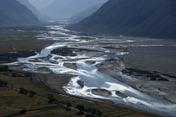 Although wide in places, the Panj River looks shallow enough to walk across in places