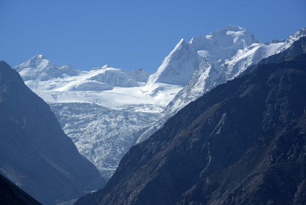 A glacier in a high valley on the Afghanistan-Pakistan border, delineated by the ridge of the Hindu Kush