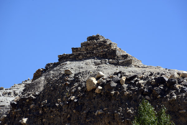 The stupa rises like a stepped pyramid above the village of Vrang, Wakhan Valley