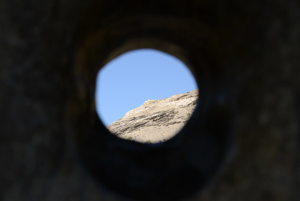 View through the stone to a point on the mountain