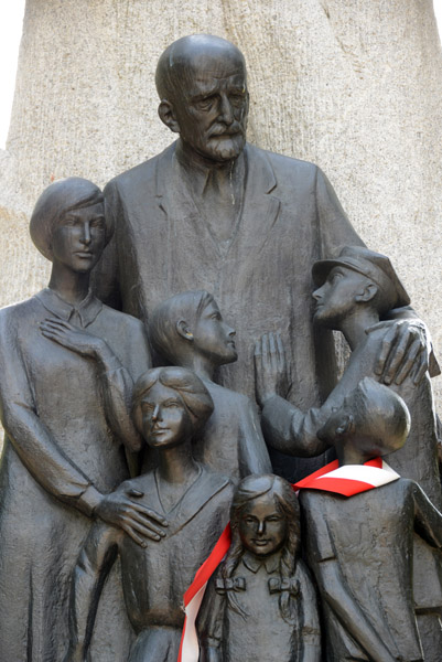 Socialist Realism sculpture of an old man and children, PKiN