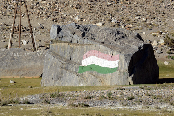 Colors of the Tajik flag painted on a rock...flip it over for the Iranian colors