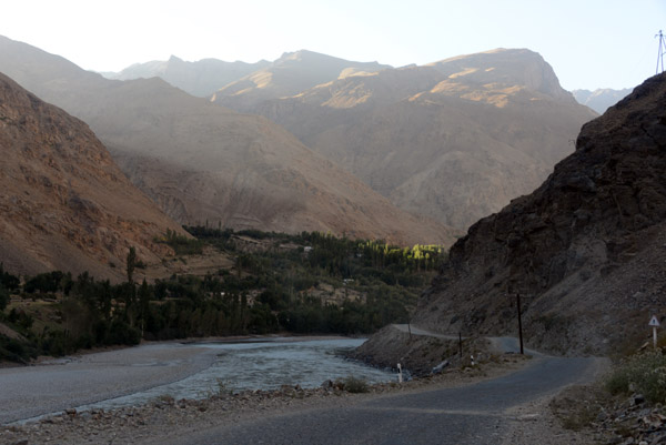 The river turns north as it approaches a large village on the Afghanistan side