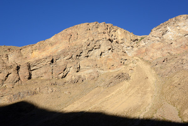 Blue sky and red stone above