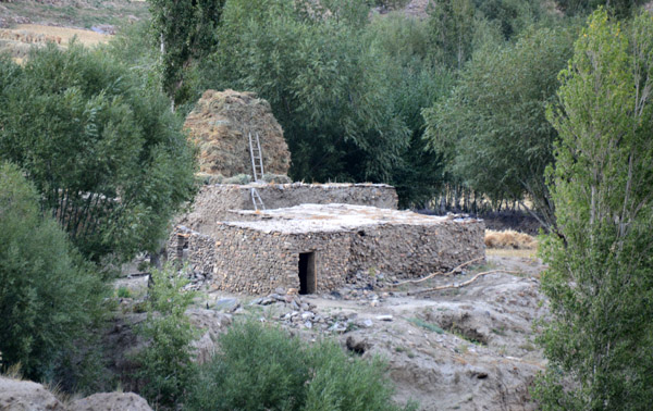 House with a large haystack, Badakhshan Province, Afghanistan