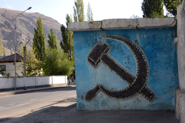 Hammer and Sickle of the USSR in stone mosaic on a Khorog bus st