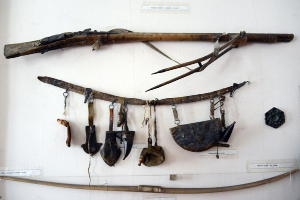 Archaic firearm and man's utility belt