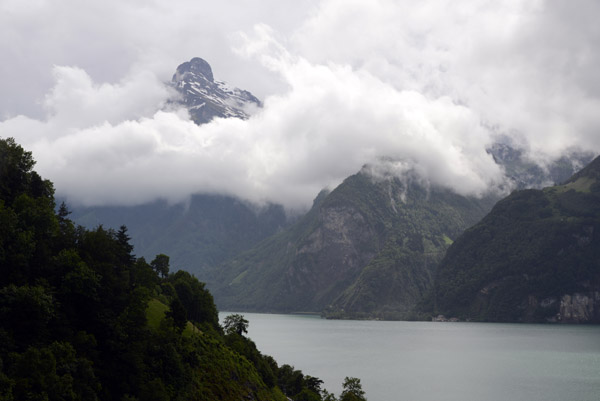Gitschen (2513m) rising through the clouds at the southeast end of Lake Lucerne