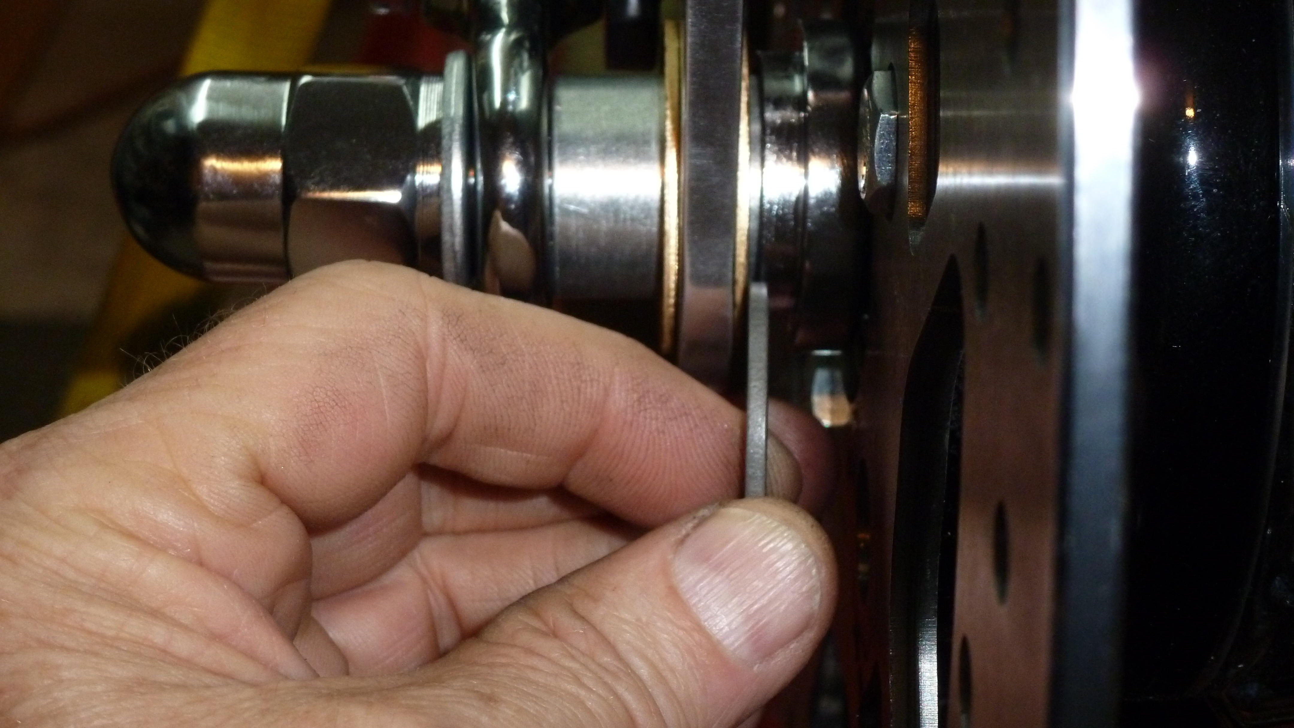 I align the caliper on the rotor and have a washer the thickness needed to shim the caliper over.