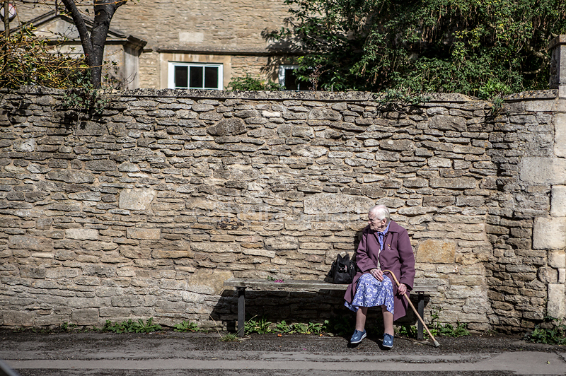 Old lady sitting on bench