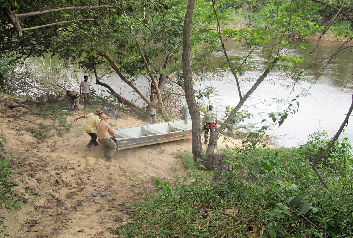 Carrying boat down to Ireng River